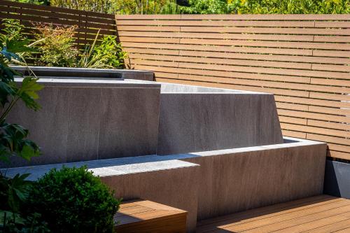 a set of concrete steps in front of a fence at Phi Hotel Piajo in Nembro