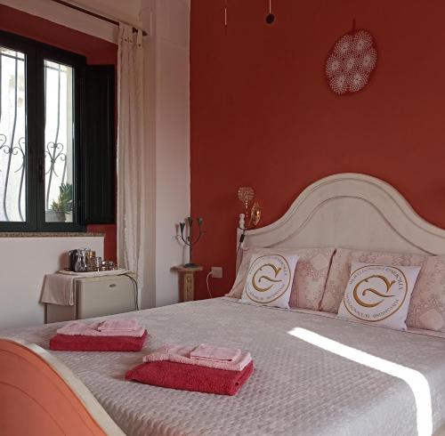 Postel nebo postele na pokoji v ubytování B&B Eleonora D'Arborea, Centro Storico