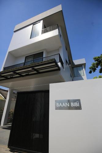 a building with a sign that reads benzan exit at BAAN BIBI near Saturday walking street in Chiang Mai