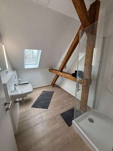 a bathroom with a sink and a shower in a attic at Modern & charmant in Dortmund in Dortmund