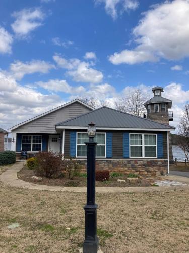 a house with a light pole in front of it at 51 The Anchor in Centre
