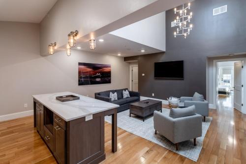 a kitchen and living room with a couch and a table at The Newport Lofts - Brick Market Place in Newport
