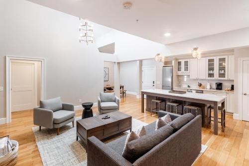 a living room with a couch and a table at The Newport Lofts - Brick Market Place in Newport