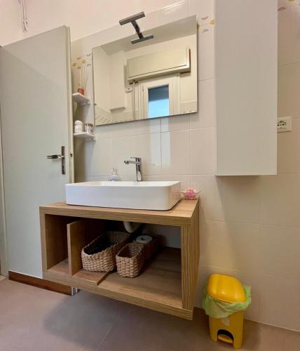 a bathroom with a sink and a mirror at La Teranga in Imola