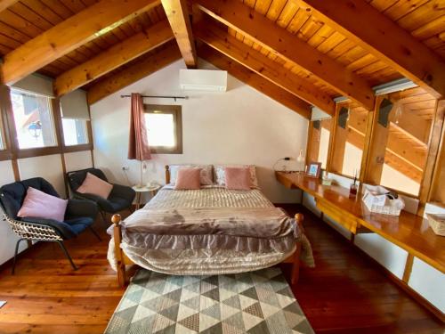 a bedroom with a bed in a room with wooden ceilings at La dimora di Dafne 48 in Monzuno