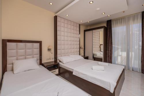 Ένα ή περισσότερα κρεβάτια σε δωμάτιο στο Deluxe Apartments Shine