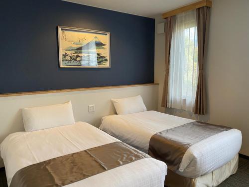 Cama ou camas em um quarto em HAOSTAY