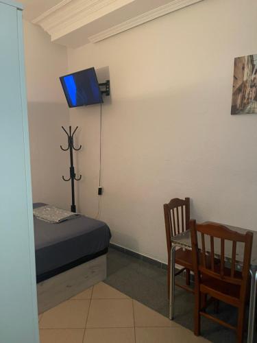 Μια τηλεόραση ή/και κέντρο ψυχαγωγίας στο Plaza Mayor GuestHouse