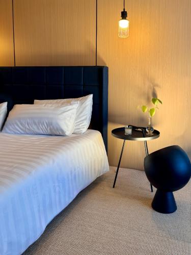 Ένα ή περισσότερα κρεβάτια σε δωμάτιο στο Villa Nuvola Suites