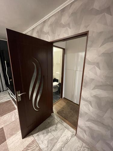 a door in a room with a wall at Home away from home in Sighetu Marmaţiei