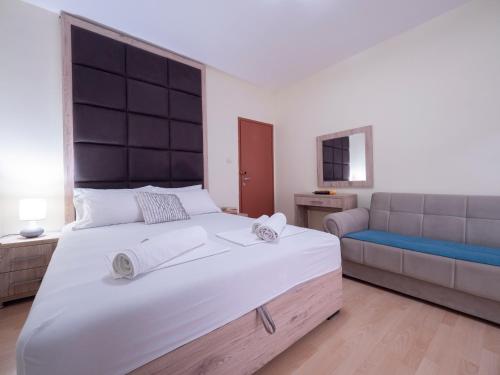 Ένα ή περισσότερα κρεβάτια σε δωμάτιο στο Palma Rooms & Suites Budva