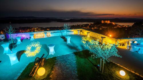 an overhead view of a swimming pool at night at Braco apartments by the sea with a sea view in Zaboric