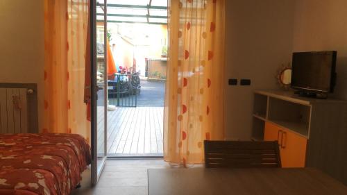 Télévision ou salle de divertissement dans l'établissement Appartamento Antares