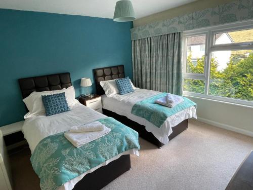 Ένα ή περισσότερα κρεβάτια σε δωμάτιο στο Ambleside 3 Bedroom Apartment
