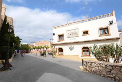 a building on a street in a town at Residencial Terra de Mar Calpe, Grupo Terra de Mar, alojamientos con encanto in Calpe