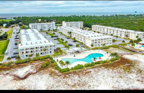 an aerial view of a resort with a pool at Stay beachy in Gulf Shores