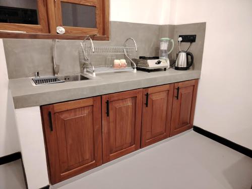 a kitchen with a sink and a counter top at Cloud9 villa weligama in Weligama