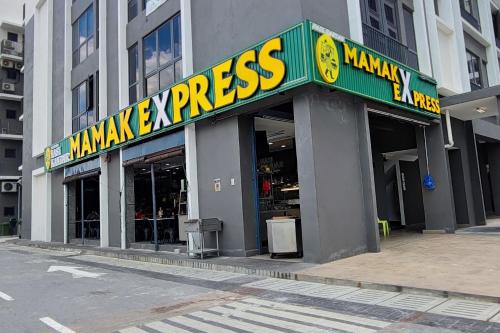 a store with a yellow and green sign on a building at Cozy Corner at EduSentral by HCK in Shah Alam
