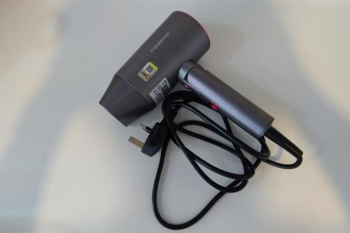 a blow dryer sitting on top of a table at Cozy Corner at EduSentral by HCK in Shah Alam