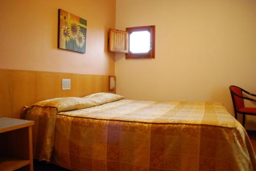 Hotel Tre Torriにあるベッド