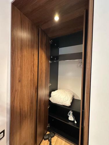 a room with a closet with a bed in it at BATUMI VIEW, appartaments 50 metres from sea in Batumi