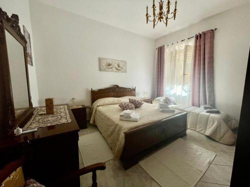 Ένα ή περισσότερα κρεβάτια σε δωμάτιο στο Casa BarorAngela