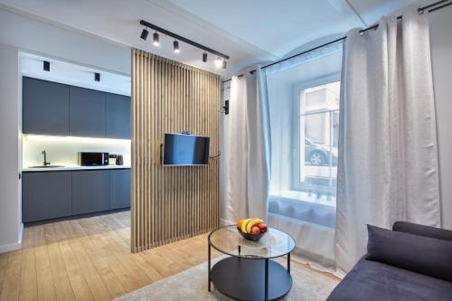 a living room with a couch and a table at Apartments in the old town in Vilnius