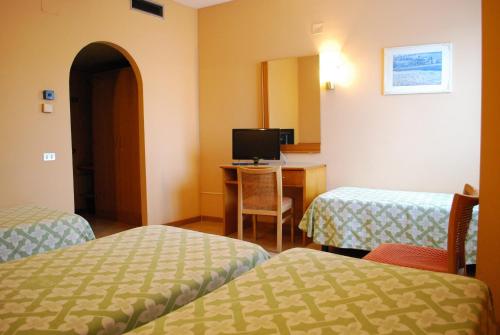 Hotel Tre Torriにあるベッド