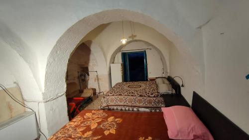 Postel nebo postele na pokoji v ubytování Alloggio in trullo con bagno indipendente