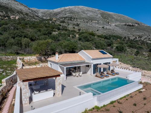 an aerial view of a house with a swimming pool at Ionian Infinity Villa in Ayia Evfimia