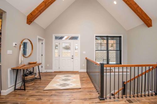 an attic room with a staircase and a mirror at Luxury Lakeside Living at Knot Working on Norris Lake in La Follette