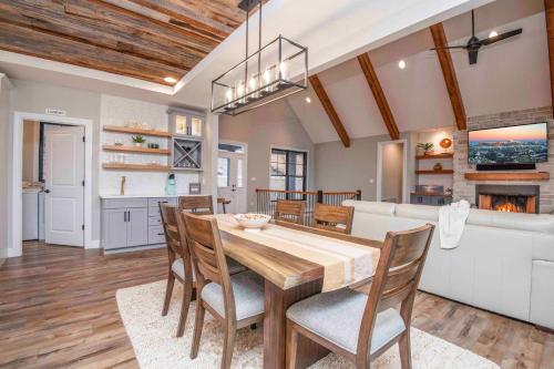 a dining room and kitchen with a table and chairs at Luxury Lakeside Living at Knot Working on Norris Lake in La Follette