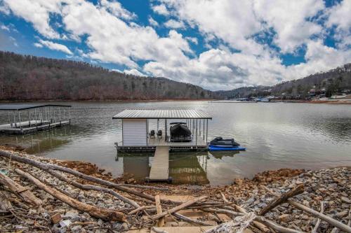 a small house on a dock on a lake at Luxury Lakeside Living at Knot Working on Norris Lake in La Follette