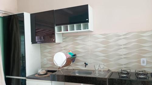 a kitchen with a sink and a counter top at COP30 Casa Completa in Barcarena