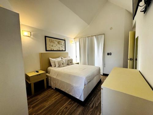 Ένα ή περισσότερα κρεβάτια σε δωμάτιο στο Auaecoco Hotel