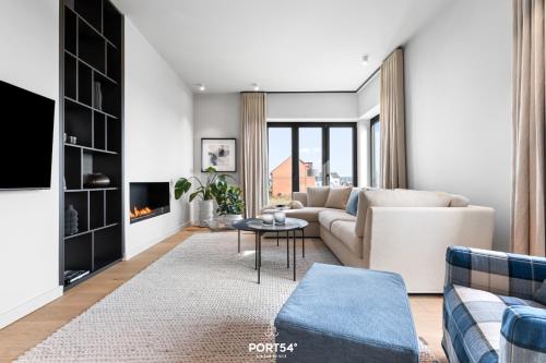 a living room with a couch and a table at Sunrise Suite List auf Sylt in List