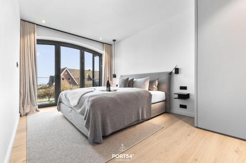 Postel nebo postele na pokoji v ubytování Turtle Bay Suite List auf Sylt