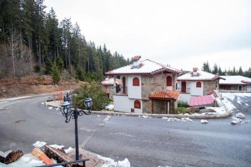 a house on the side of a road at 2 bedroom, 2 showeroom Villa suitable for a family skication and remote working in Pamporovo