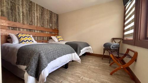 Entre Cumbres Apart Hotelにあるベッド