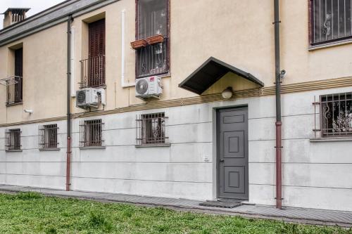 a building with a door on the side of it at Courtyard House Rho - Fiera Milano in Rho
