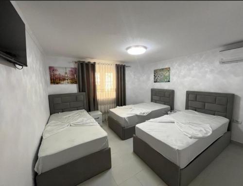 Ένα ή περισσότερα κρεβάτια σε δωμάτιο στο Vila flavjo