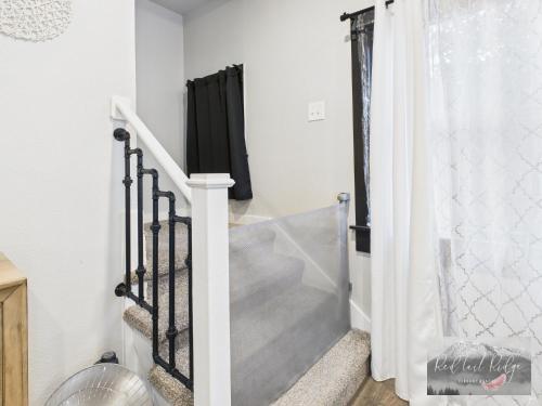 a staircase in a home with a shower curtain at Historical Albany Downtown House with 5 Bedrooms in Albany