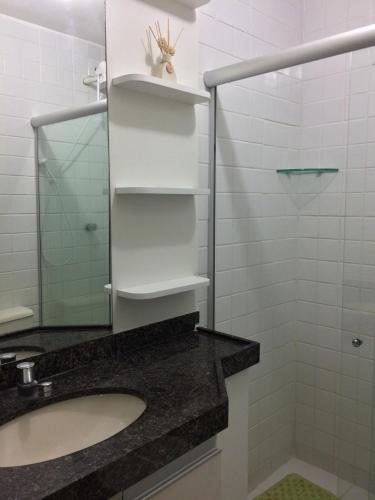 a bathroom with a sink and a mirror at FLAT MONTE CASTELO - Flat10 Mod04 in Sairé