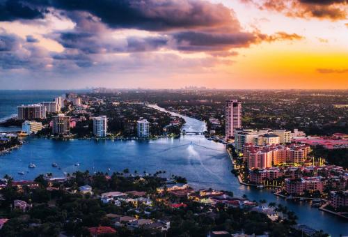 a view of a city with a river and buildings at Beachside Luxury Private Townhome with Pool and Ocean Views in Boca Raton