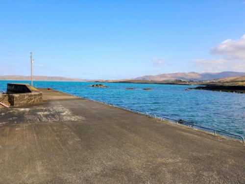 a road next to a body of water at Sugarbush in Eyeries