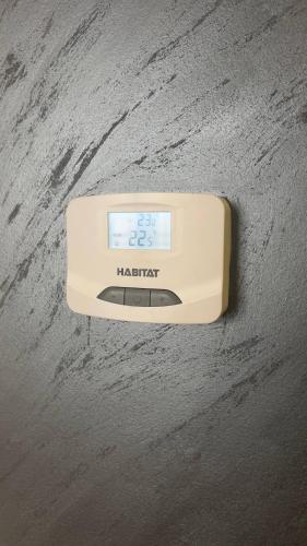 a digital thermometer sitting on top of a table at Stan na dan Veternik in Veternik