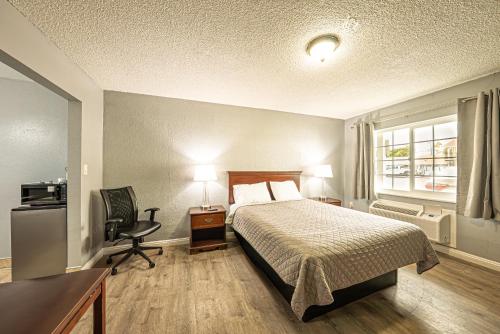 Ένα ή περισσότερα κρεβάτια σε δωμάτιο στο Villa Motel