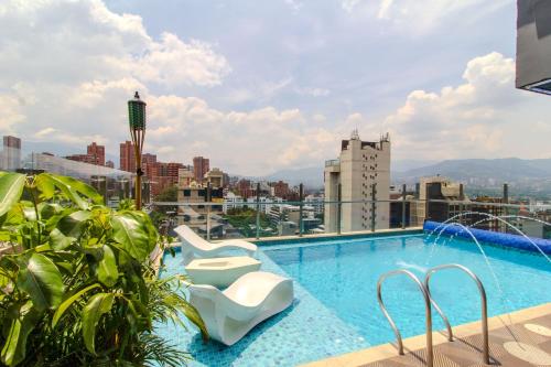 a swimming pool on the roof of a building at Haven A Design Hotel in Medellín