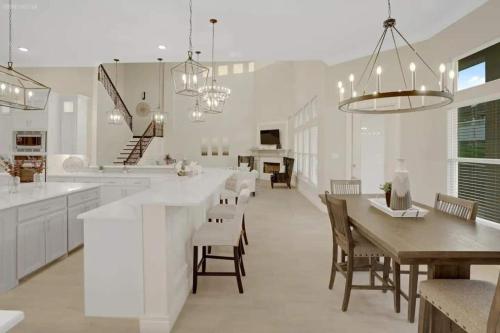 a kitchen and dining room with a table and chairs at 298 5 Bedrooms Fenced yard New Construction in Robstown