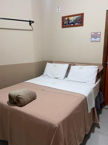 Ένα ή περισσότερα κρεβάτια σε δωμάτιο στο Hotel Bee's Sorriso